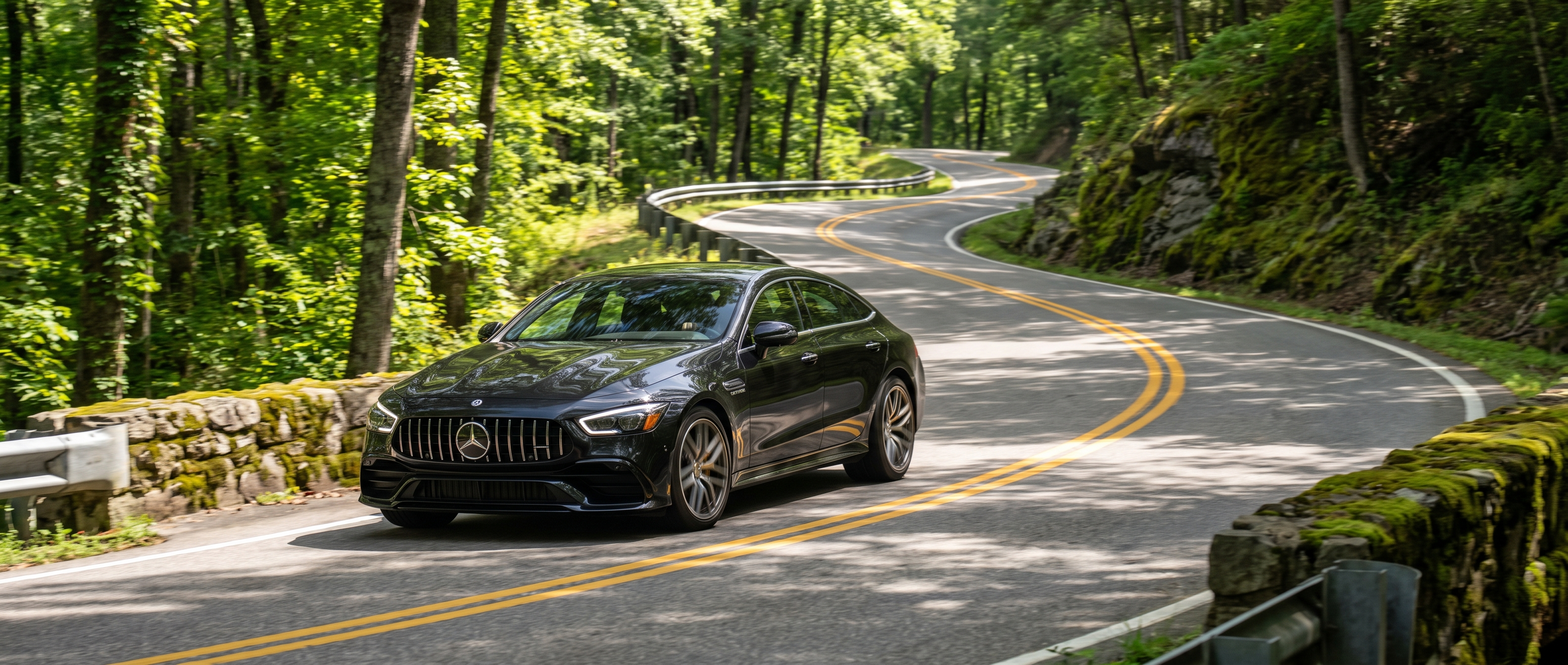 2026 Mercedes-AMG GT 43 4-Door Coupe on a winding North Georgia mountain road in summer